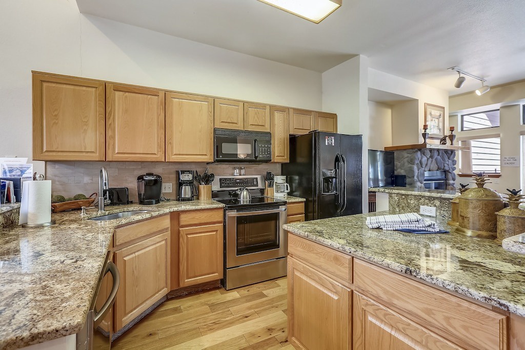 Your spacious kitchen awaits with granite countertops, stainless steel appliances, and all the tools you need to create memorable meals.