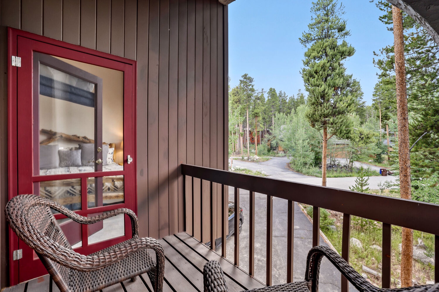 Step outside to your private balcony and breathe in the fresh mountain air. Gaze over tall pines and peaceful forest surroundings, with comfortable seating where you can sip your morning coffee or unwind after a day of exploring.
