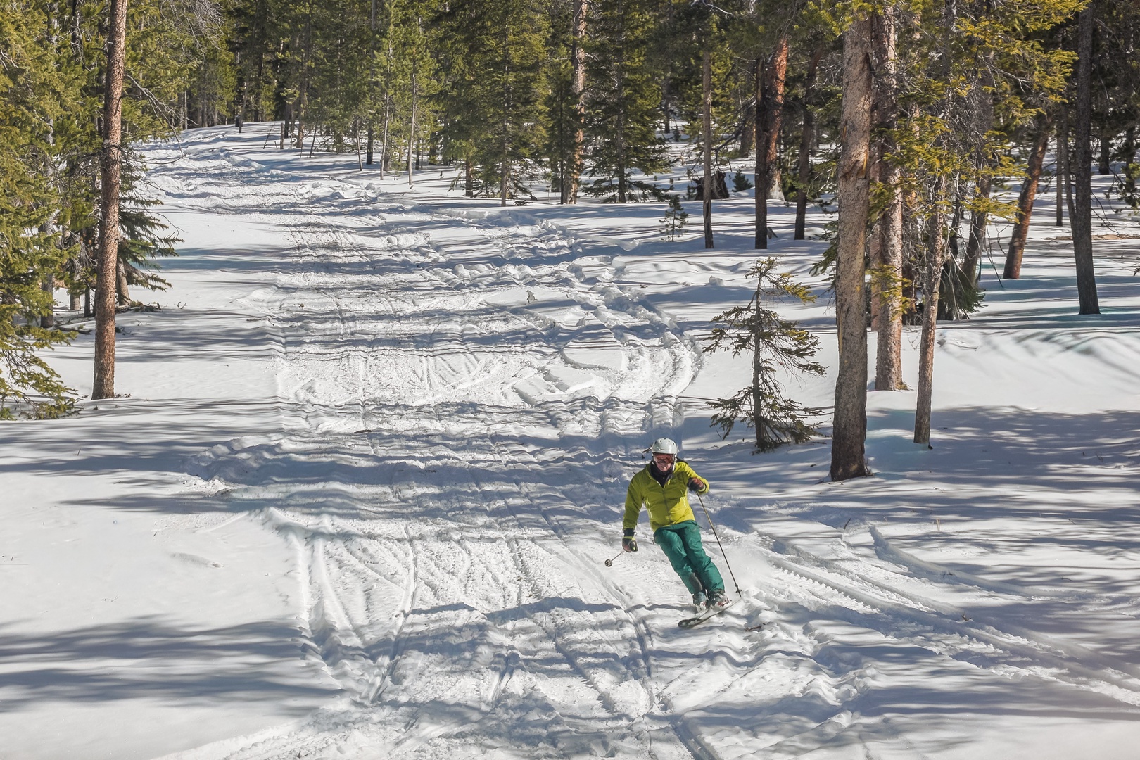 Pristine powder slopes wind through evergreen forests, offering thrilling tree-lined runs just steps from your mountain retreat.