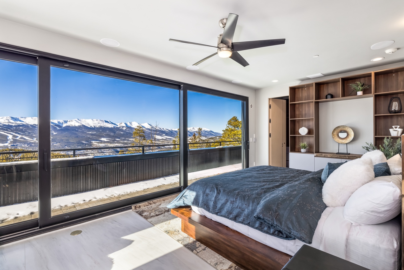 Wake up to breathtaking mountain views from your luxurious bedroom, where floor-to-ceiling windows frame snow-capped peaks perfectly.