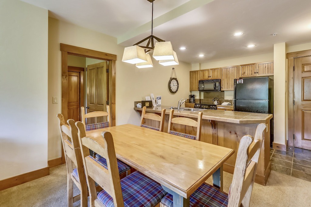 Gather around this welcoming dining space where your group can share meals and create memories together in comfort.