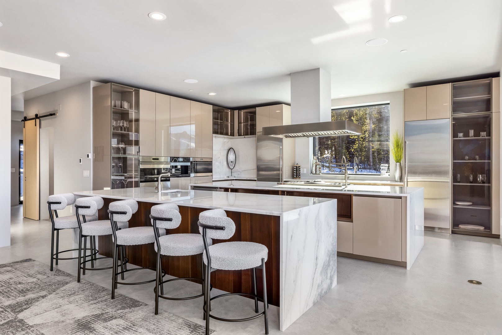 Step into your dream culinary space with gleaming marble countertops, professional-grade appliances, and a stunning breakfast bar perfect for morning coffee or evening cocktails.