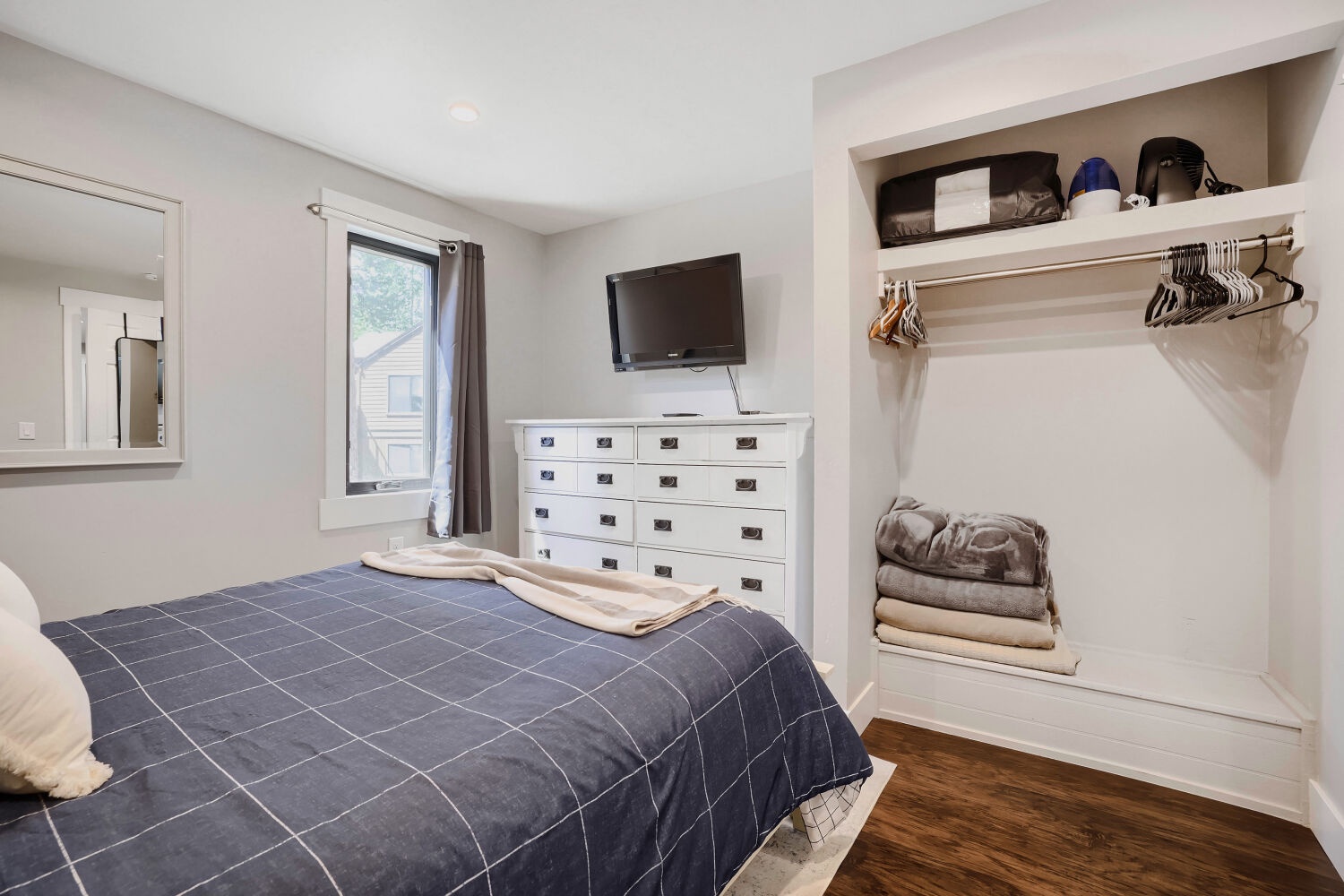 Your cozy bedroom features a plush bed, organized closet space, and natural light—perfect for unwinding after exploring the city.