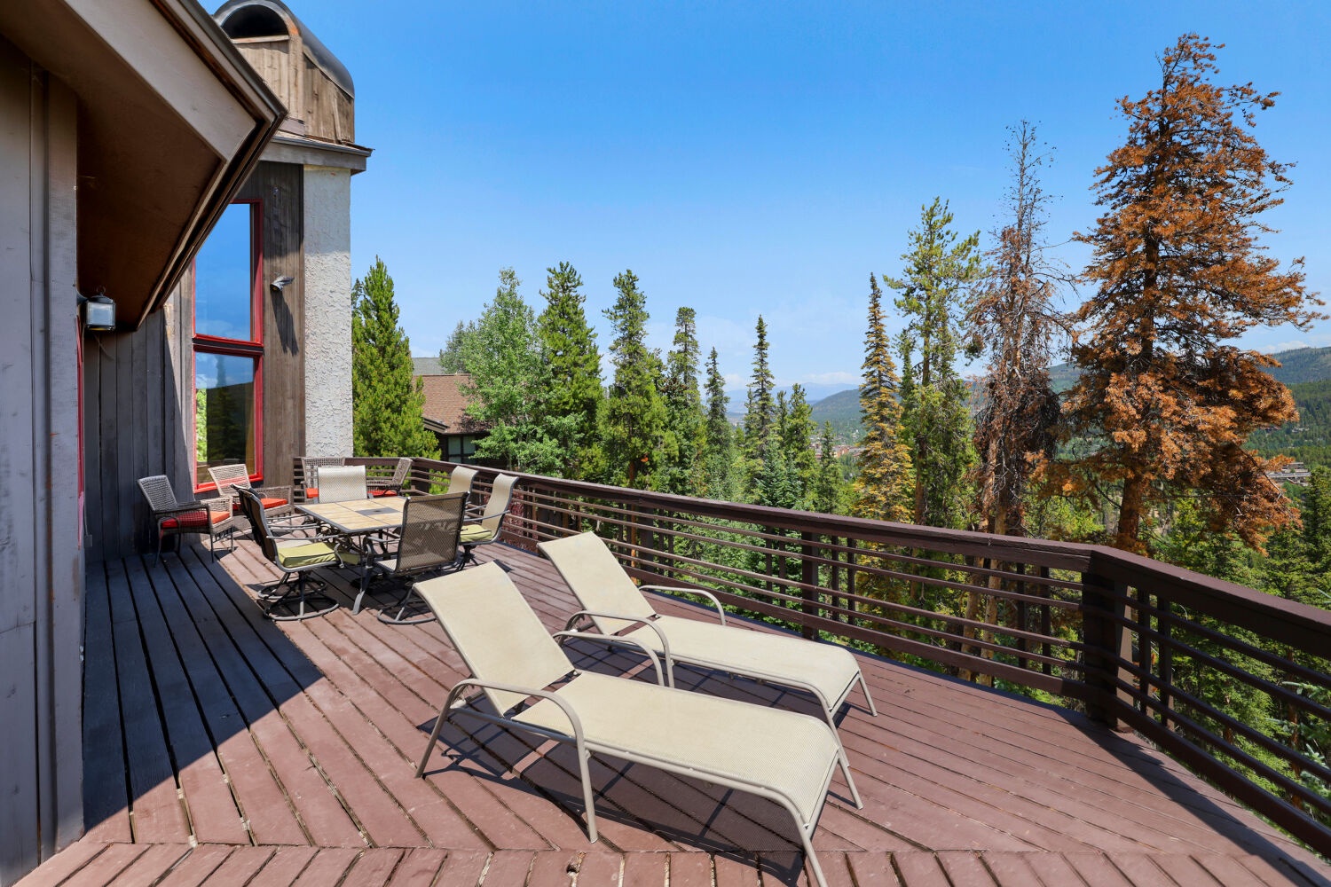 Stretch out on your private deck overlooking towering pines and distant mountain ridges—perfect for morning coffee or sunset gatherings.