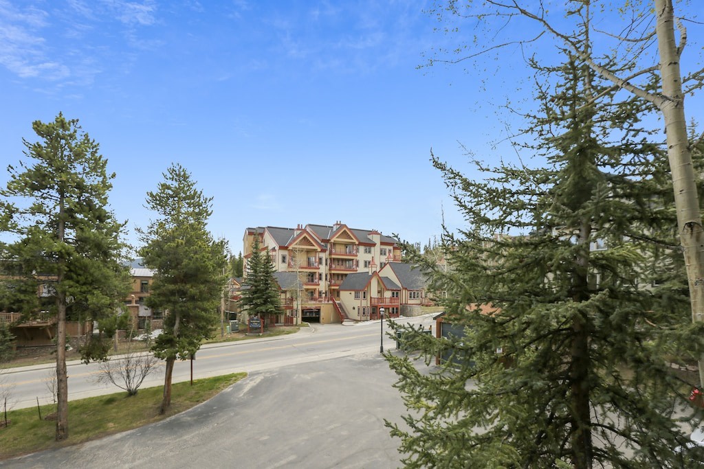 Charming mountain village setting with forest surroundings and quiet residential streets near the property.