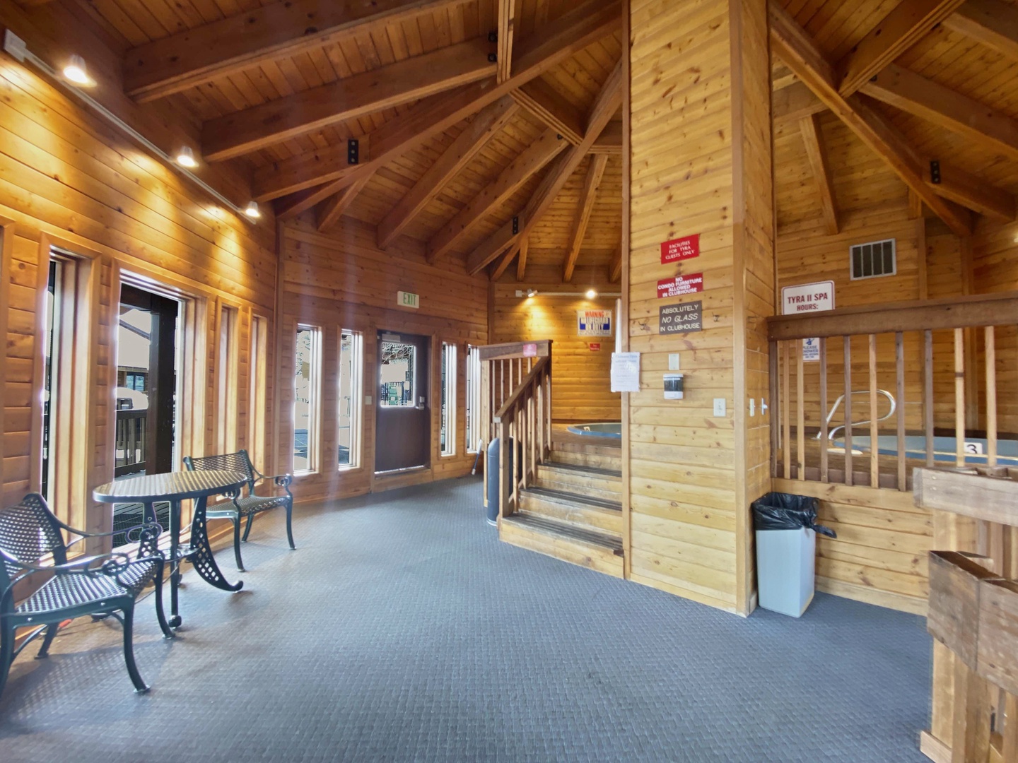 Step into this welcoming wooden lodge-style lounge where you can unwind after exploring. The rustic timber beams create a cozy atmosphere for relaxation.