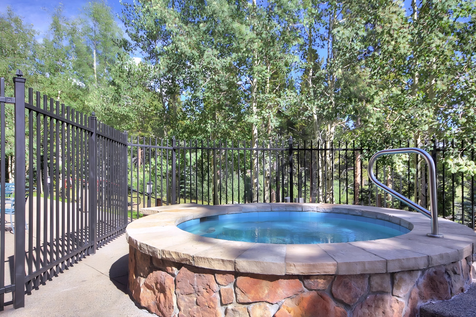 Soak away stress in your private stone hot tub, surrounded by towering trees and mountain air.