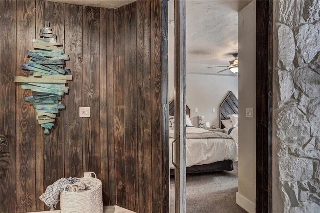 Step into your rustic retreat where weathered wood meets contemporary comfort, featuring stunning handcrafted art that sets the perfect mountain lodge ambiance.