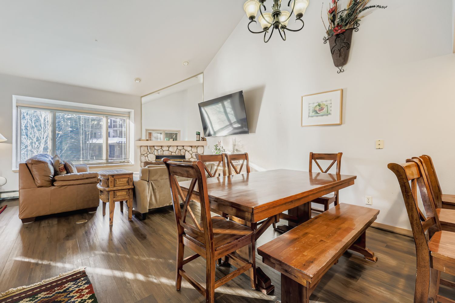 Gather around this rustic dining table where your morning coffee and evening meals become cherished moments together.