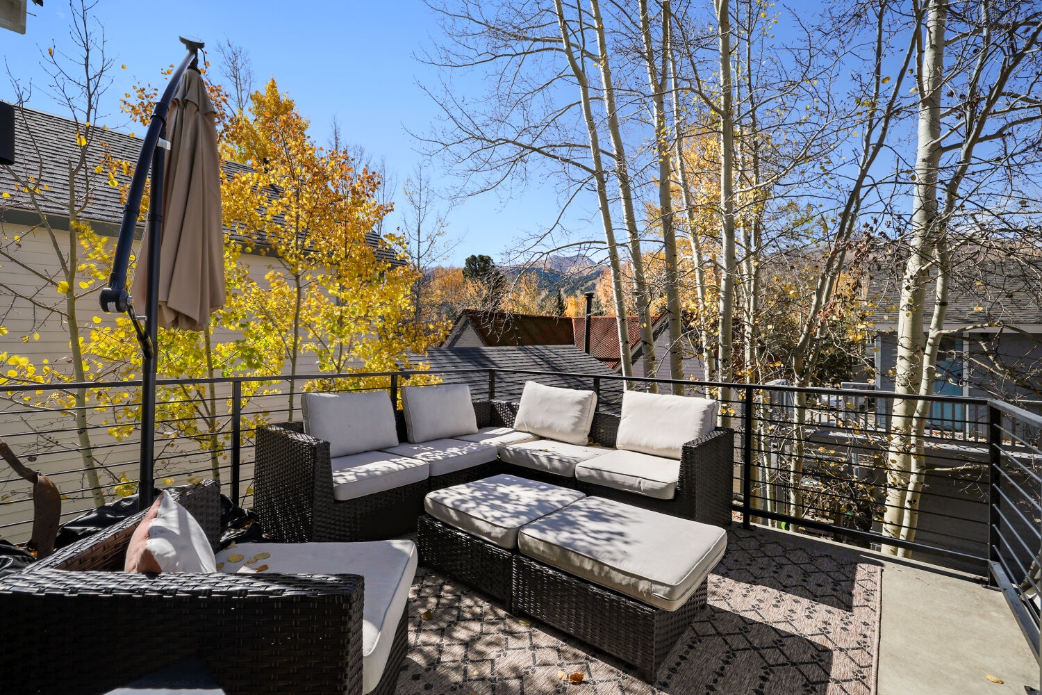 Relax on your private deck surrounded by golden autumn foliage and mountain views. The perfect spot to unwind with morning coffee or evening drinks under the open sky.