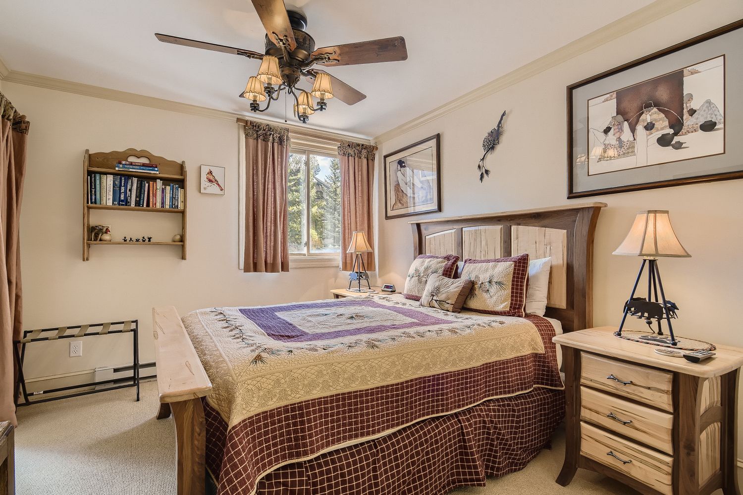 Settle into your cozy mountain retreat bedroom with rustic charm, soft quilts, and peaceful forest views from your window.