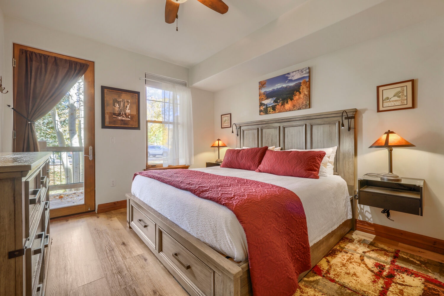 Step into your serene retreat, where a plush king bed awaits beneath a vaulted ceiling. Warm wood tones, soft lighting, and your own private patio door invite you to unwind in comfort and style.