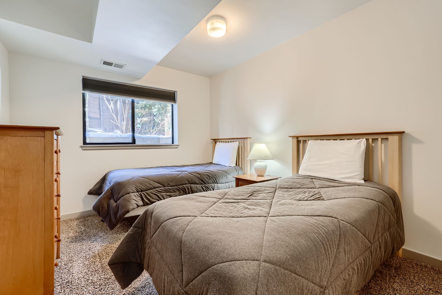 Drift off to sleep in your cozy twin bedroom, where soft linens and warm lighting create the perfect retreat after adventurous days.