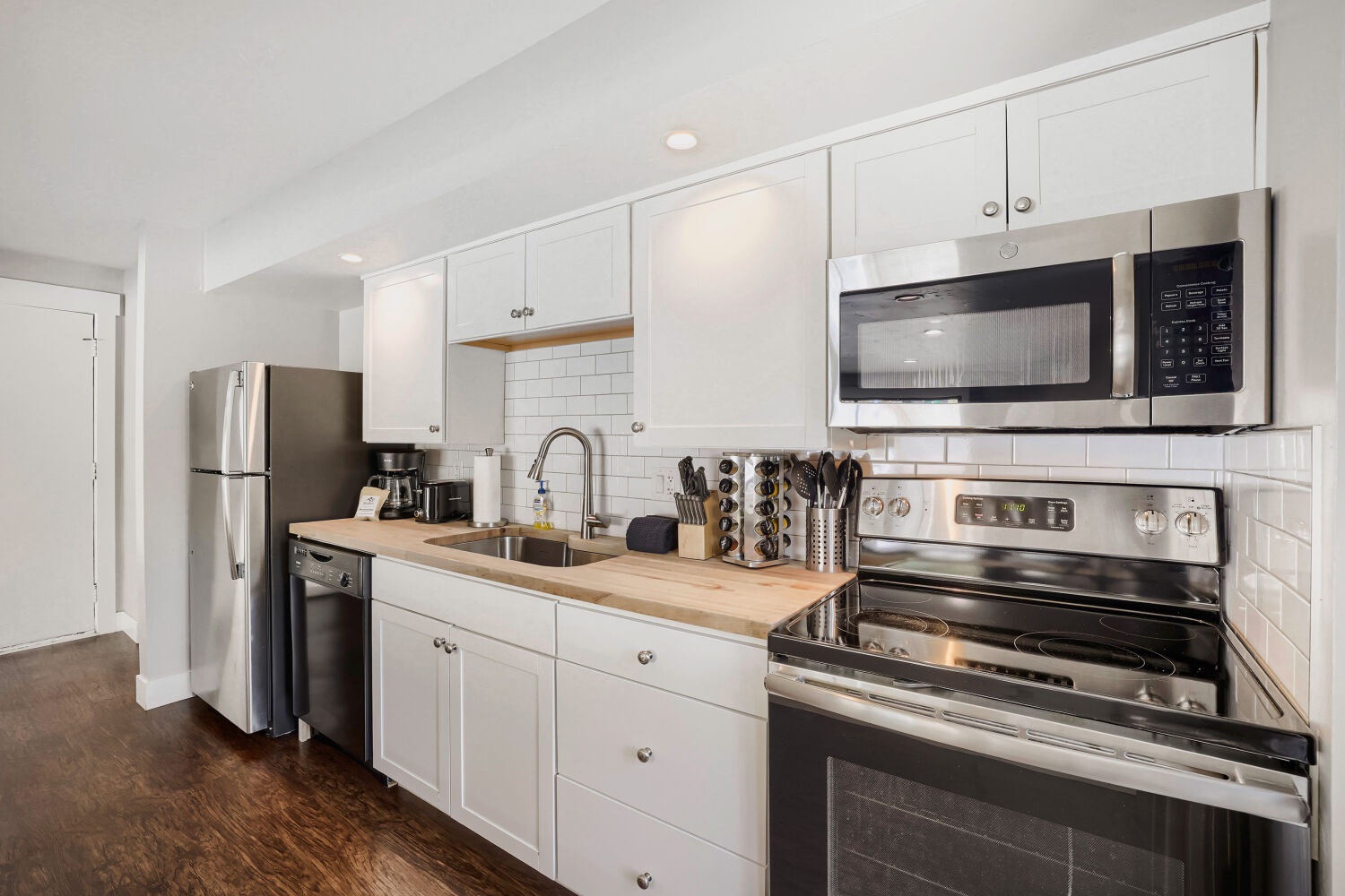 Your fully equipped kitchen features stainless steel appliances, butcher-block countertops, and all the essentials for preparing your favorite home-cooked meals during your stay.