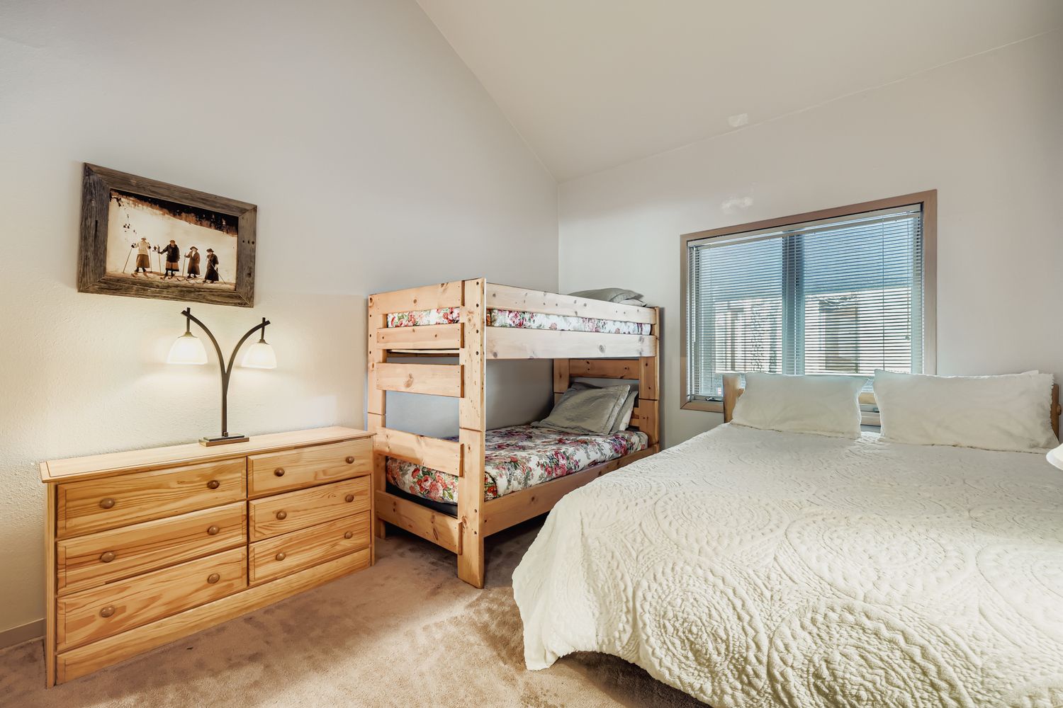 Cozy family bedroom with bunk beds and mountain views - perfect for creating lasting memories with your loved ones.
