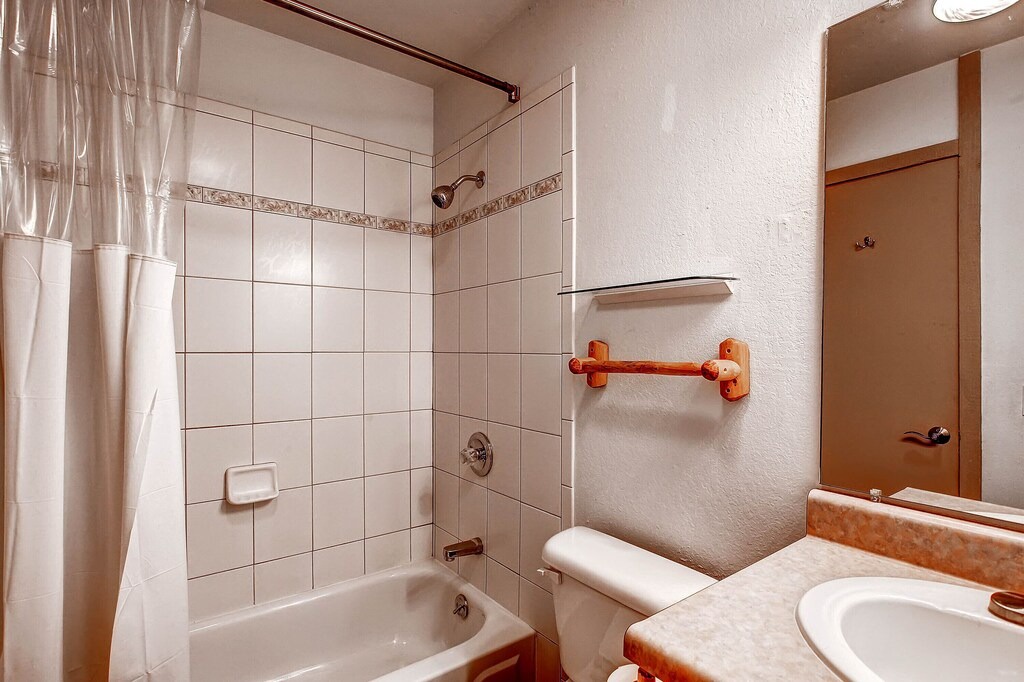 Your private bathroom features a relaxing tub-shower combo with fresh linens and thoughtful safety features for your comfort.