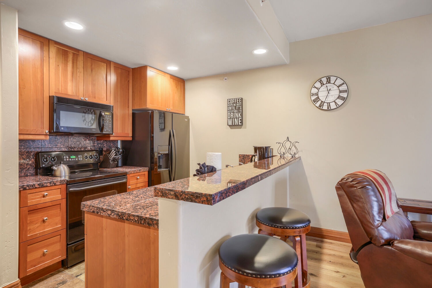Your fully-equipped kitchen with granite countertops and breakfast bar invites you to craft memorable meals and share stories over morning coffee.