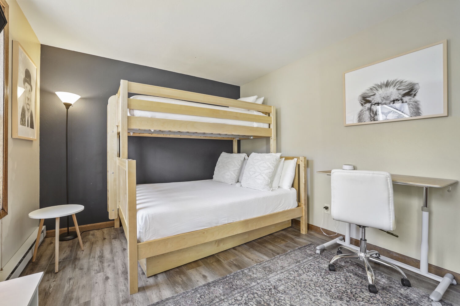 Settle in and make yourself at home in this cozy bunk room, where crisp linens and a peaceful alpaca print invite you to unwind after a day exploring the area.