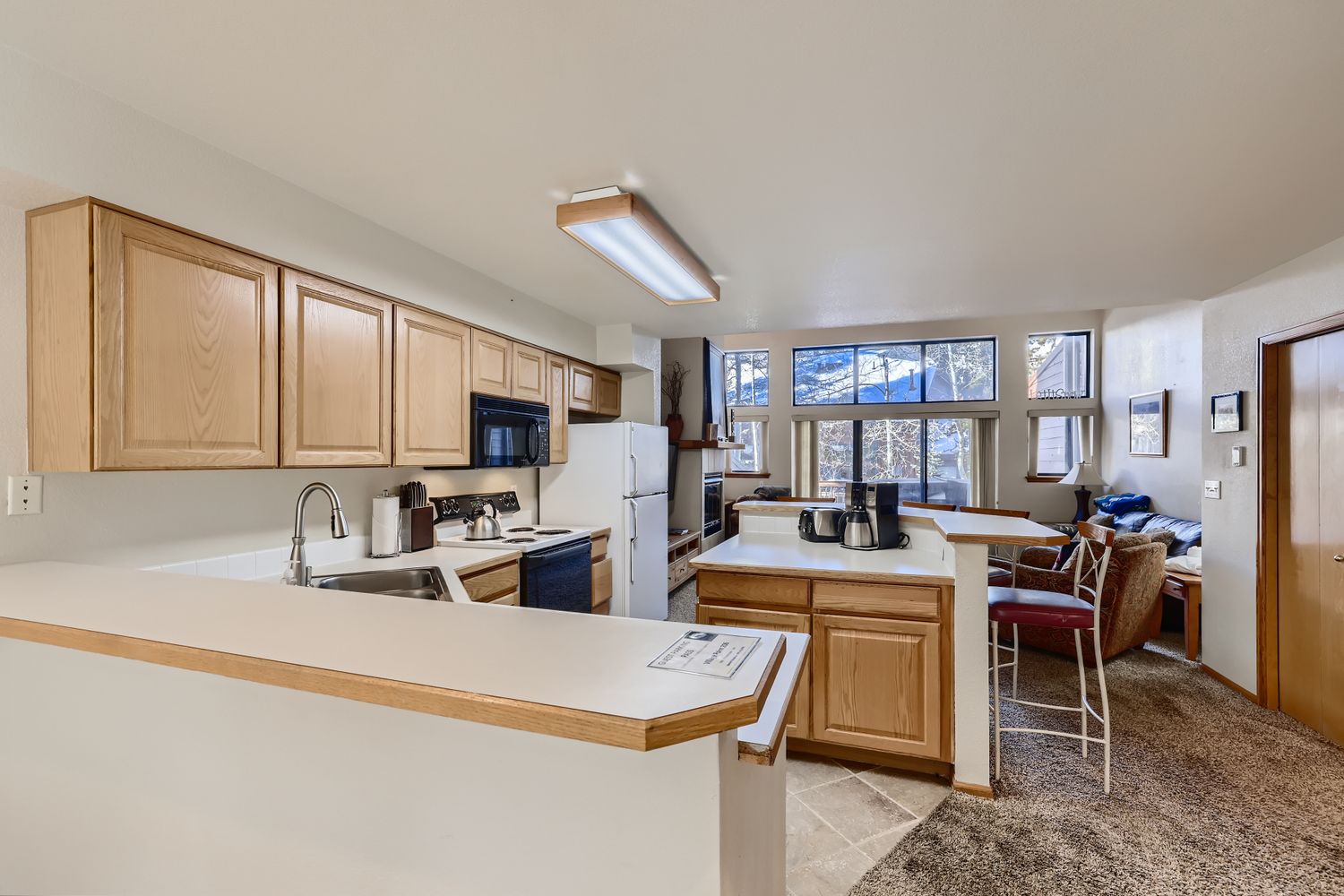 Your fully-equipped kitchen opens into a bright living space where you'll love cooking together and gathering around the breakfast bar.