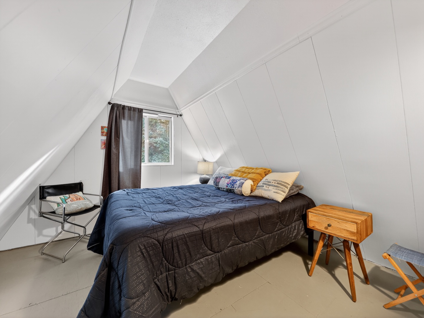 Inviting guest bedroom with warm cabin touches