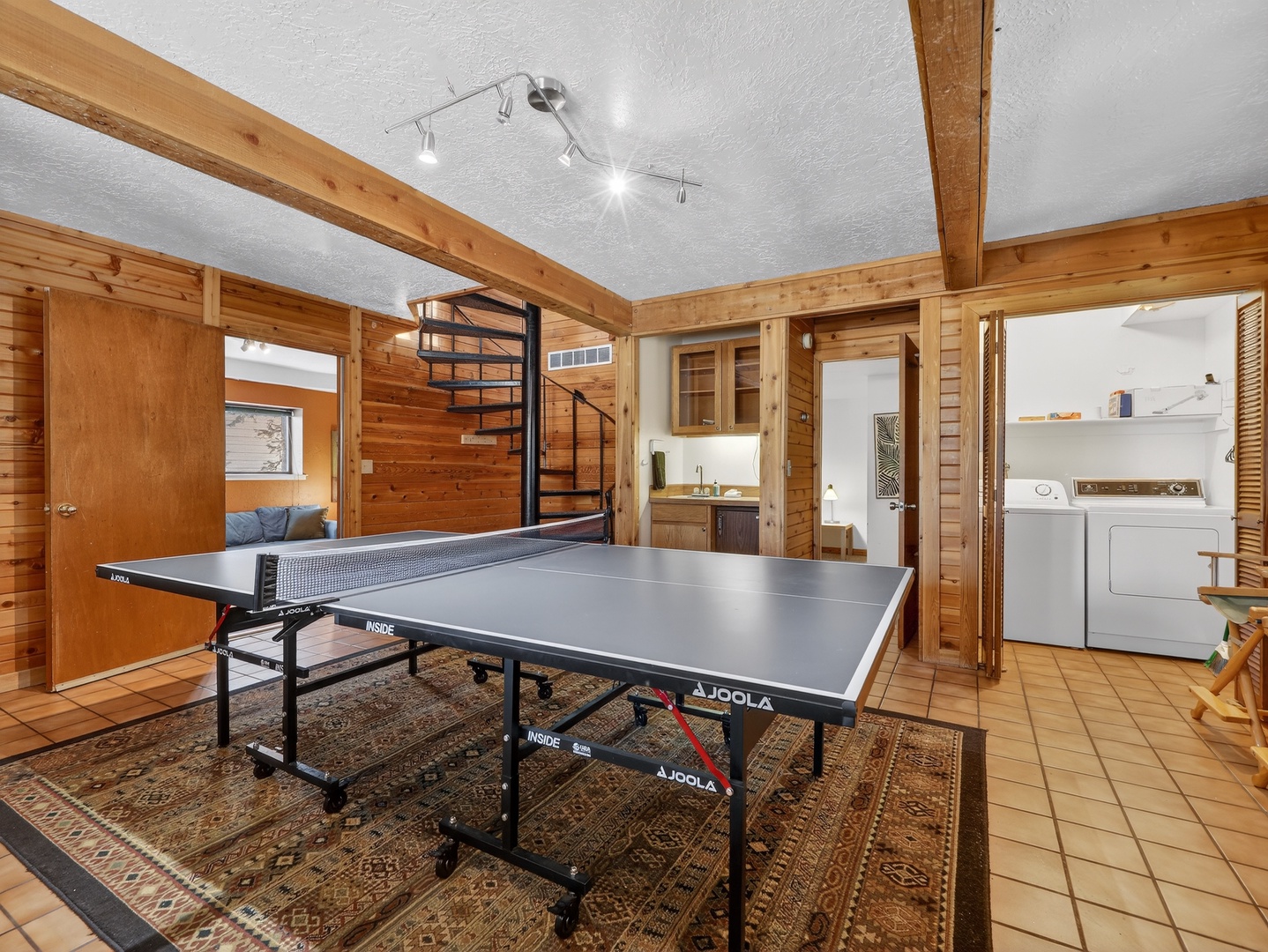 Challenge friends to table tennis in this warm pine-paneled game room, complete with laundry facilities nearby.