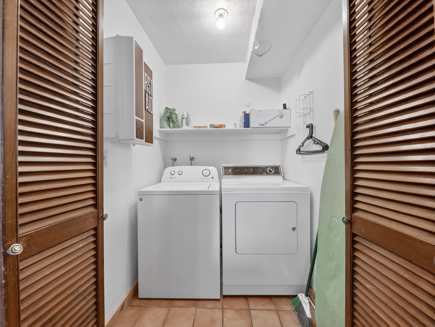 Your dedicated laundry room keeps your vacation wardrobe fresh with full-size washer and dryer, plus convenient storage shelving.