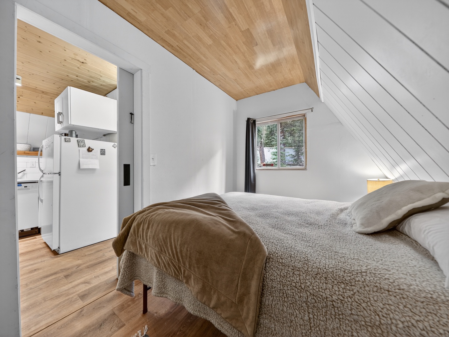Comfortable primary bedroom designed for restful nights in the mountains