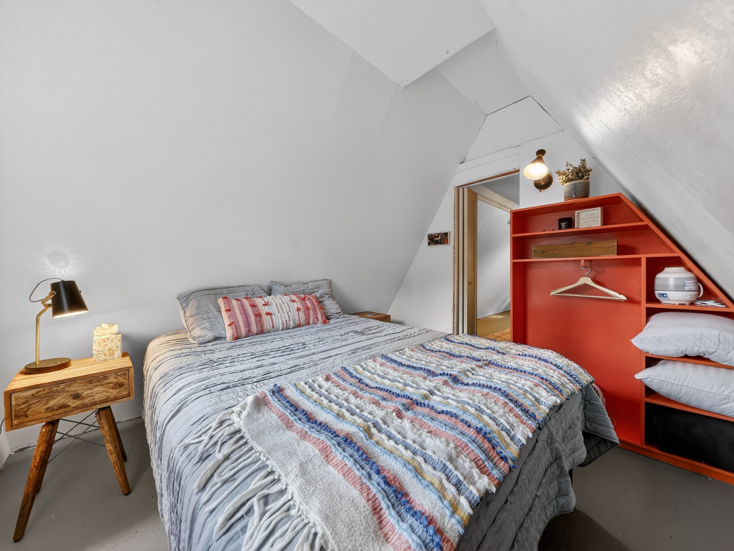 Inviting guest bedroom with warm cabin touches