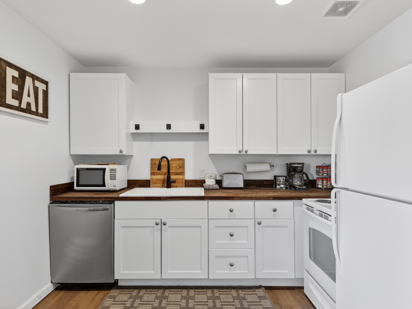 Bright, functional kitchen—perfect for morning coffee or a cozy night in