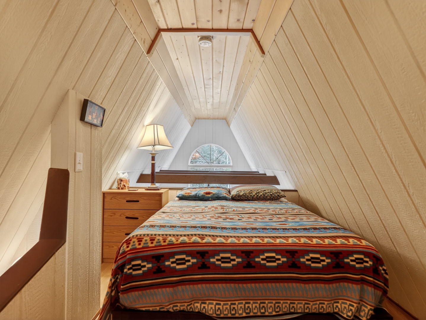 Charming loft-style sleeping space with classic A-frame character