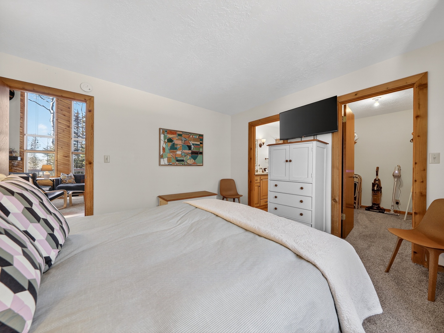 Drift off to sleep in your cozy bedroom, complete with TV and charming wood accents throughout.