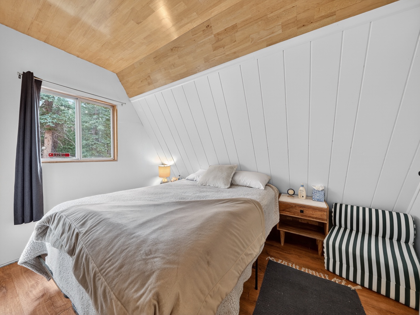 Comfortable primary bedroom designed for restful nights in the mountains