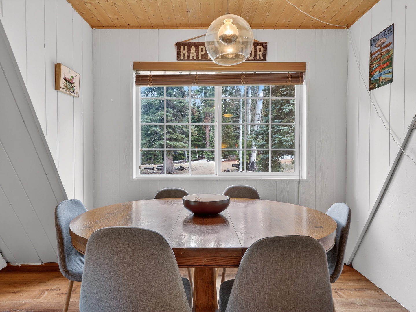 Cozy dining space for shared meals and connection with view to the trees