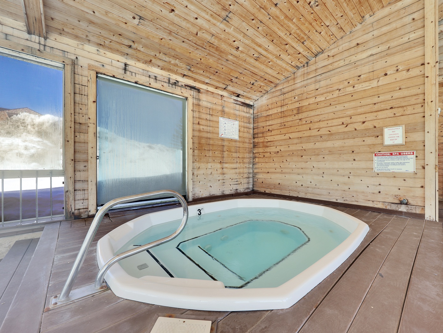 Soak away your cares in your private hot tub, surrounded by warm wood and stunning mountain views through expansive windows. The perfect spot to unwind after a day of adventure.