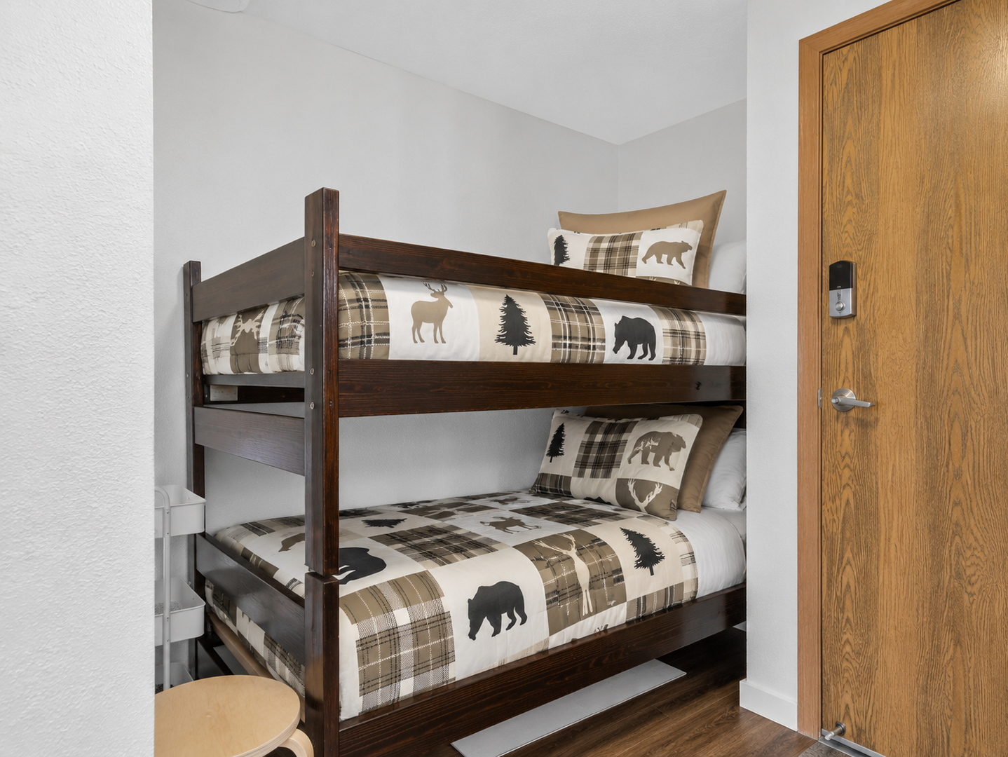 Cozy bunk nook with rustic mountain-inspired bedding — perfect for kids or extra guests