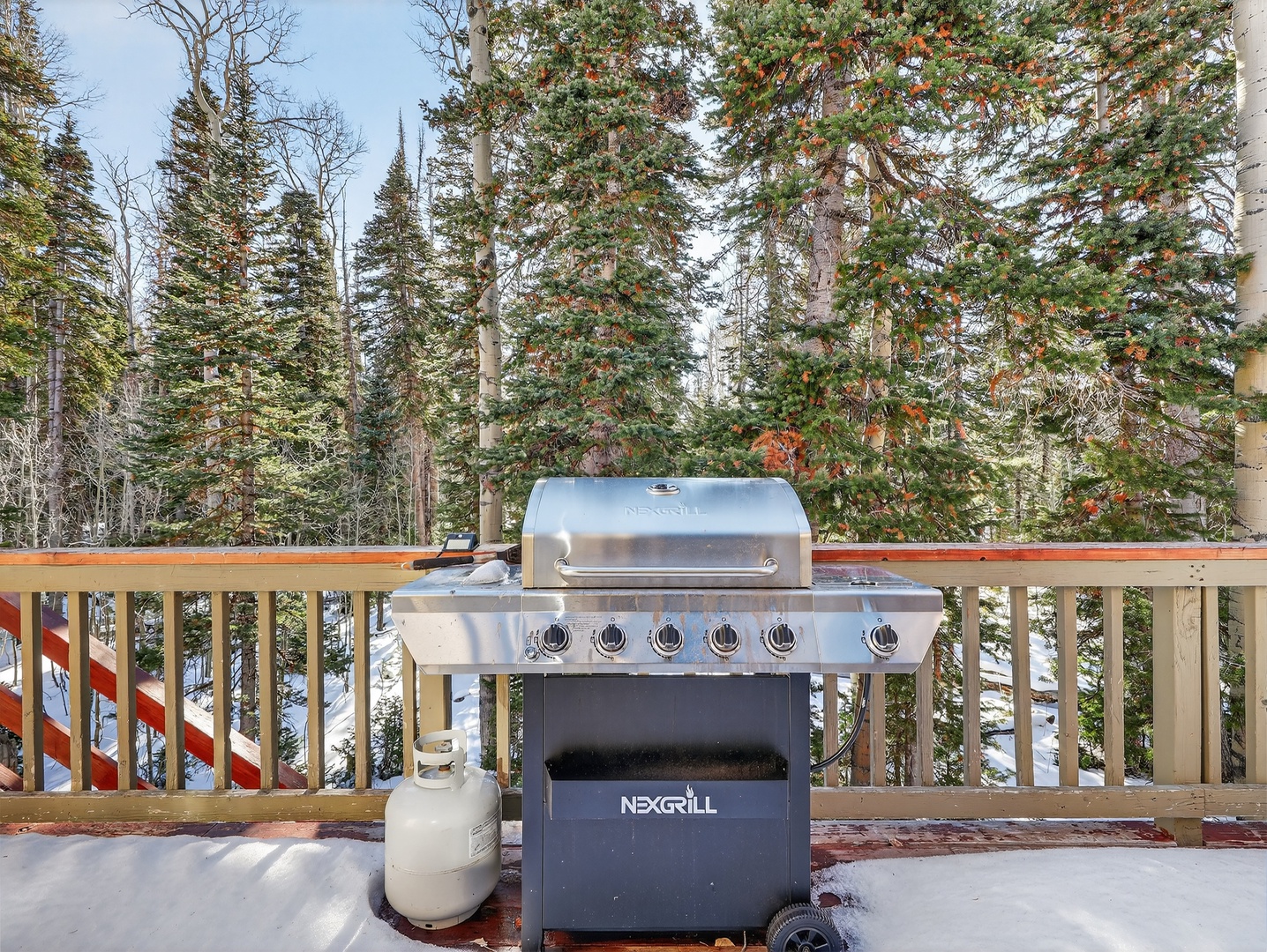 Fire up the grill year-round on your private deck, surrounded by towering evergreens and fresh mountain air.