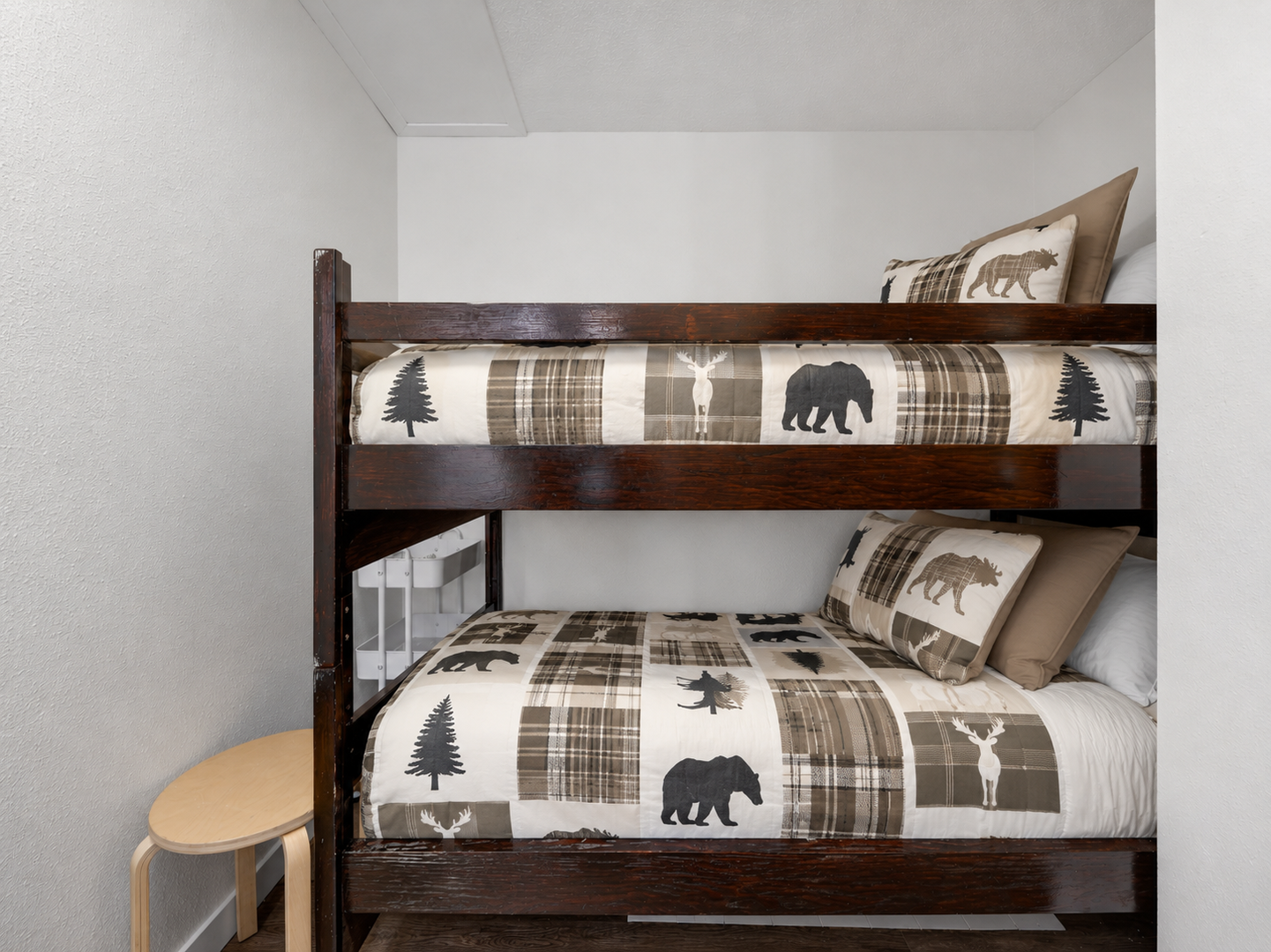 Cozy bunk nook with rustic mountain-inspired bedding — perfect for kids or extra guests