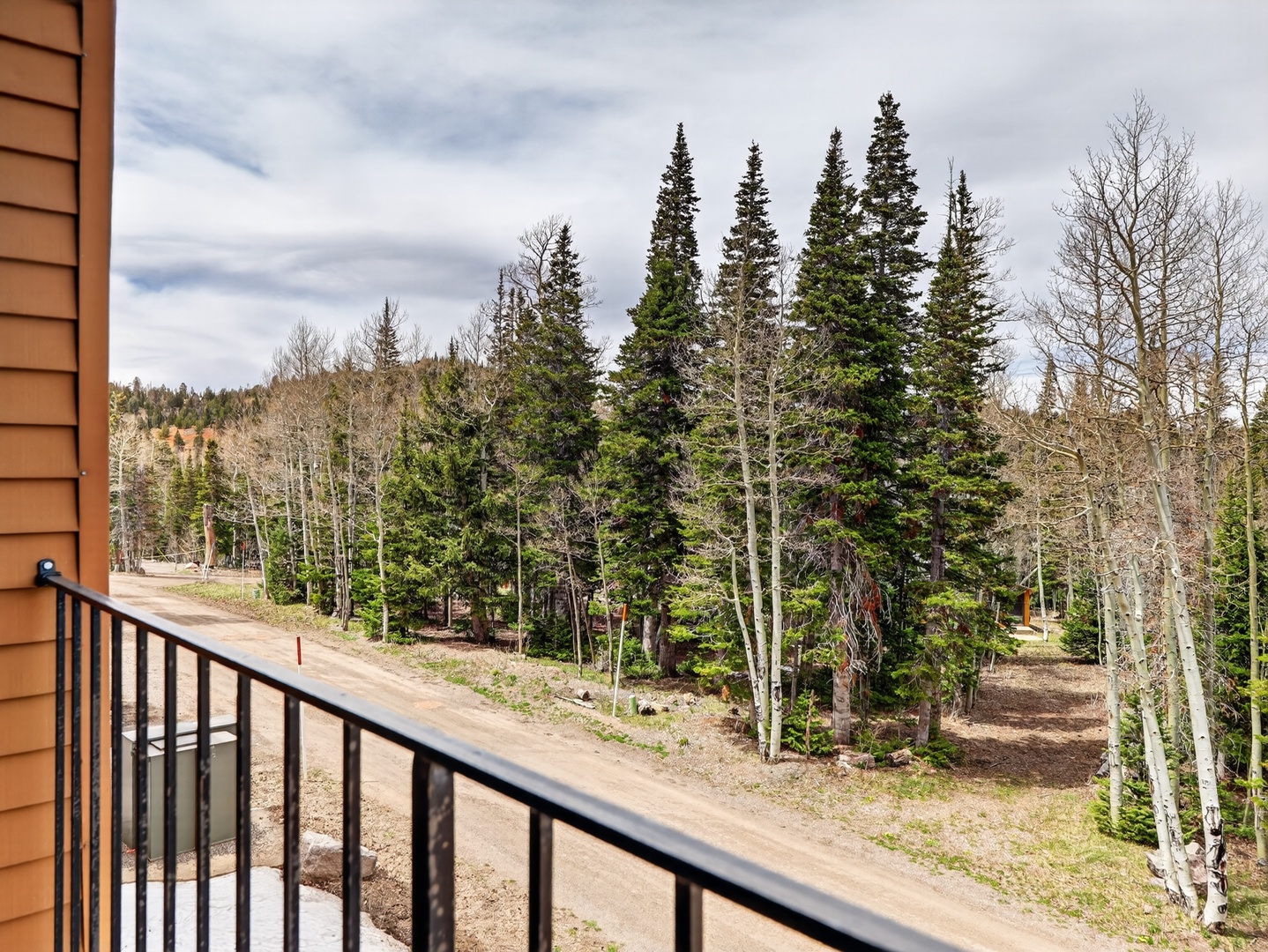 Private balcony overlooking the trees — perfect for morning coffee or fresh mountain air.