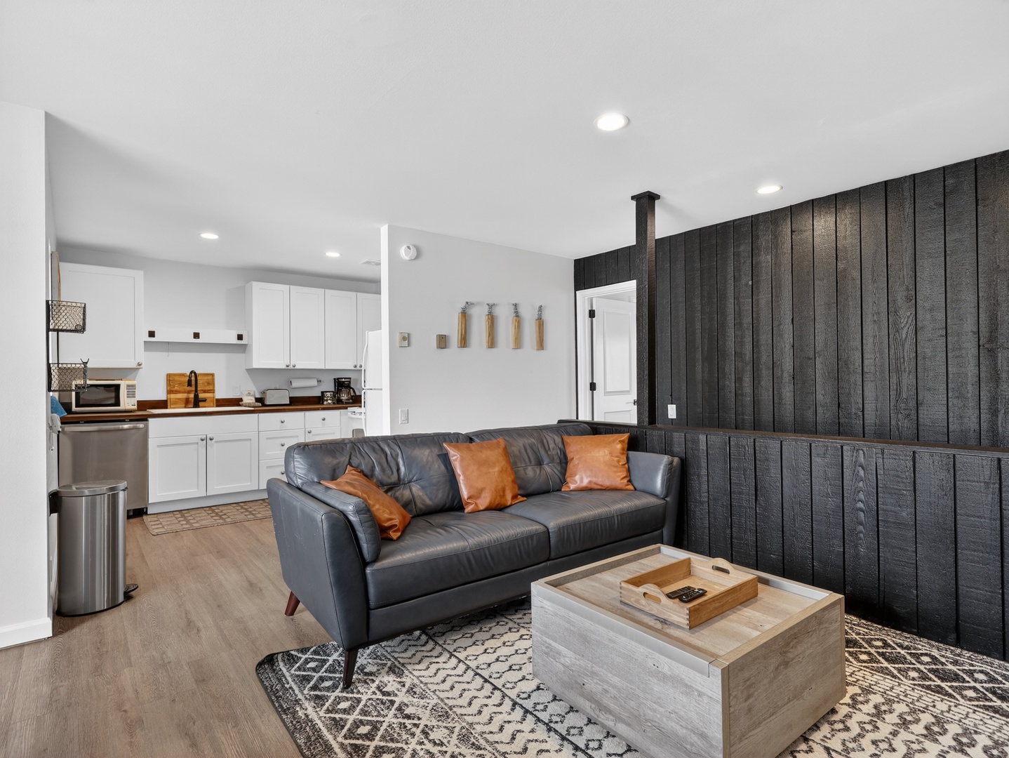 Open-concept living with fireplace, Smart TV, and dining area—perfect for relaxing after a day on the mountain