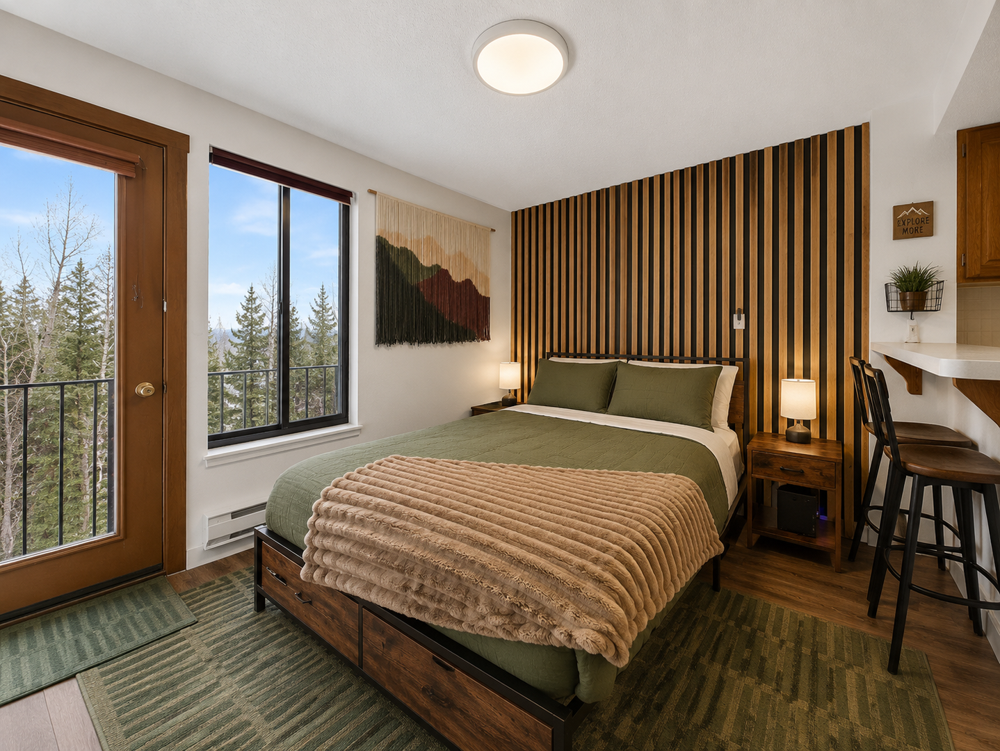 Sink into the plush bedding and wake to mountain views from your window. The open-concept space features a full kitchen and breakfast bar, perfect for cozy mornings in.