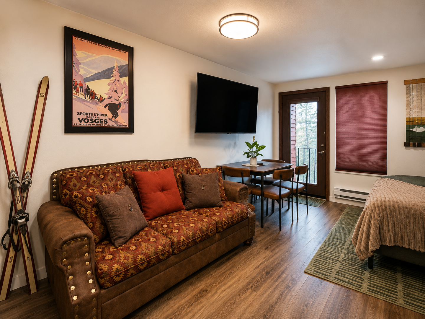 Cozy lounge area with Smart TV, mountain-inspired décor, and space to unwind after a day on the slopes.