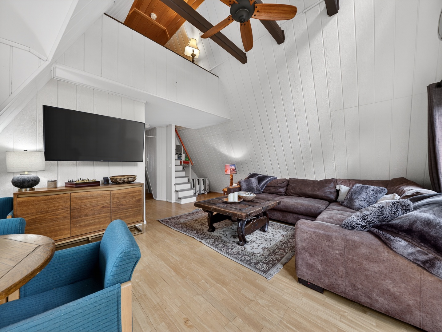 Open living space with soaring ceilings and cozy cabin charm