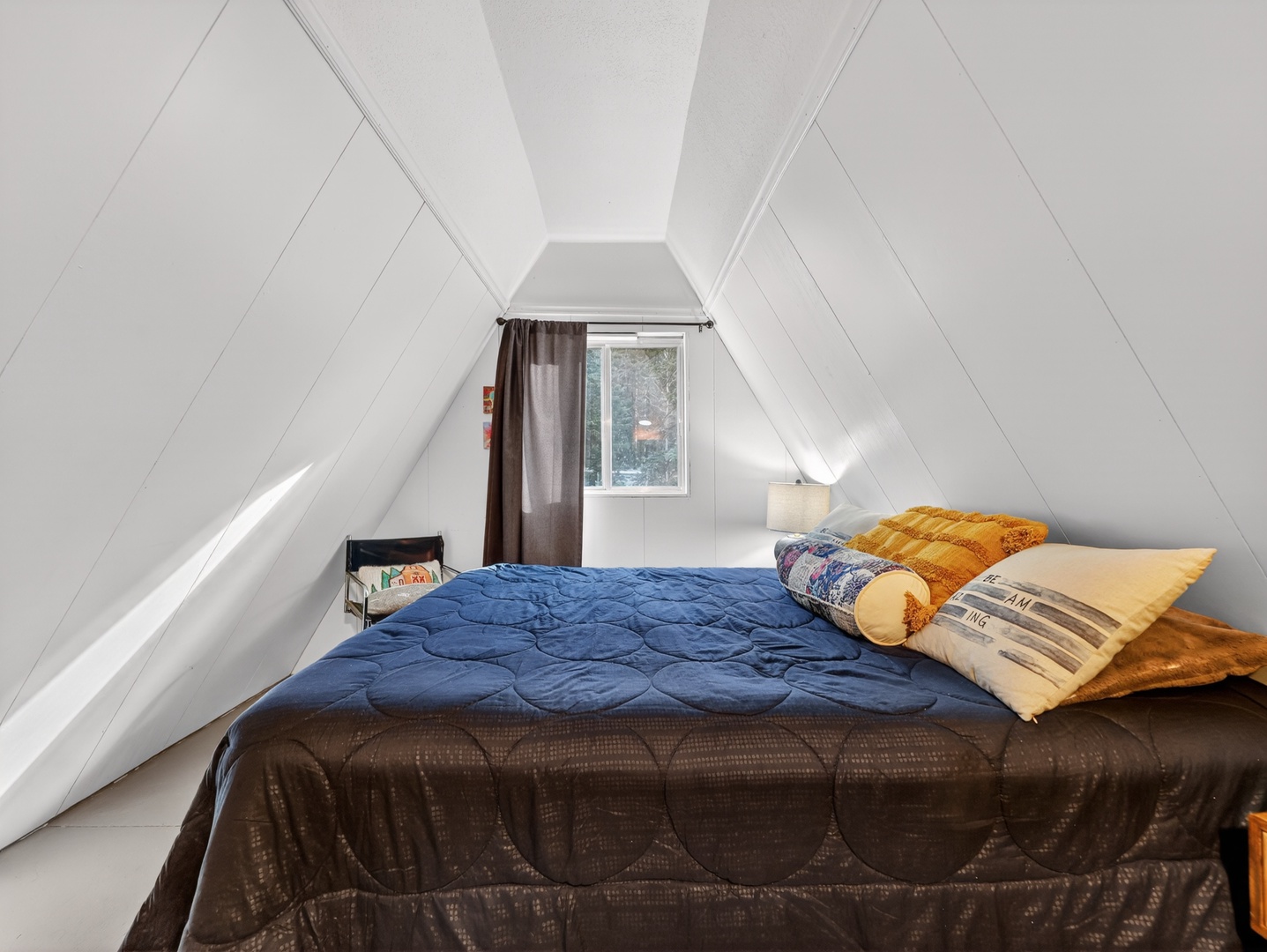 Inviting guest bedroom with warm cabin touches