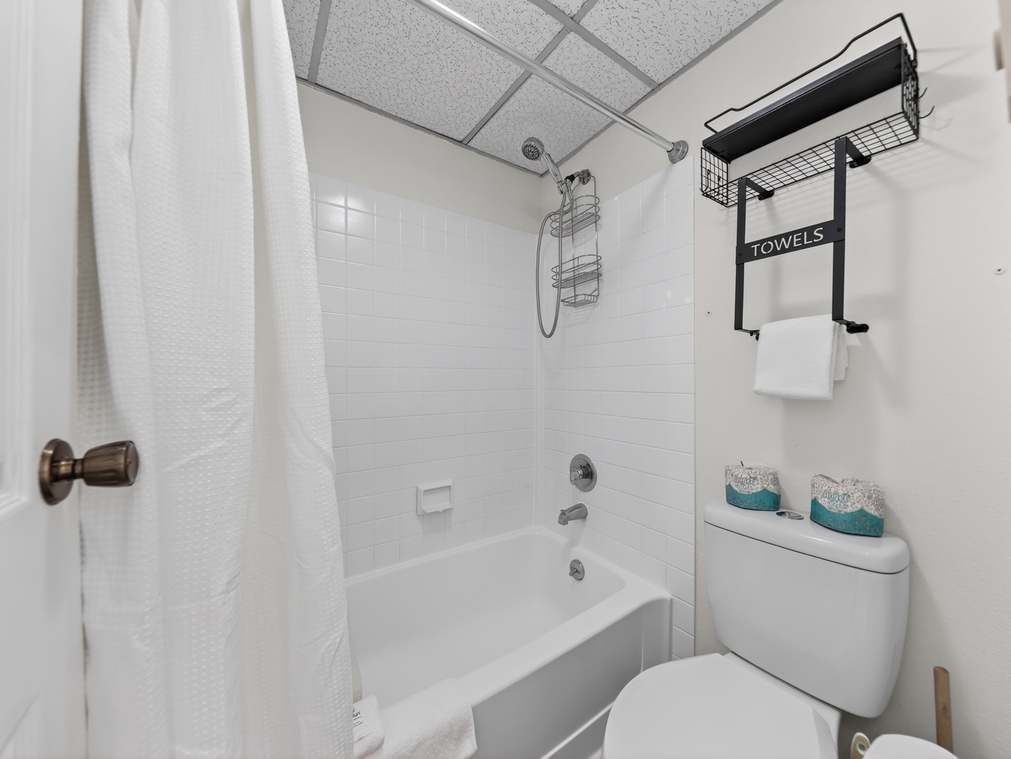Clean and refreshed bathroom stocked with fresh towels and essentials for your stay.