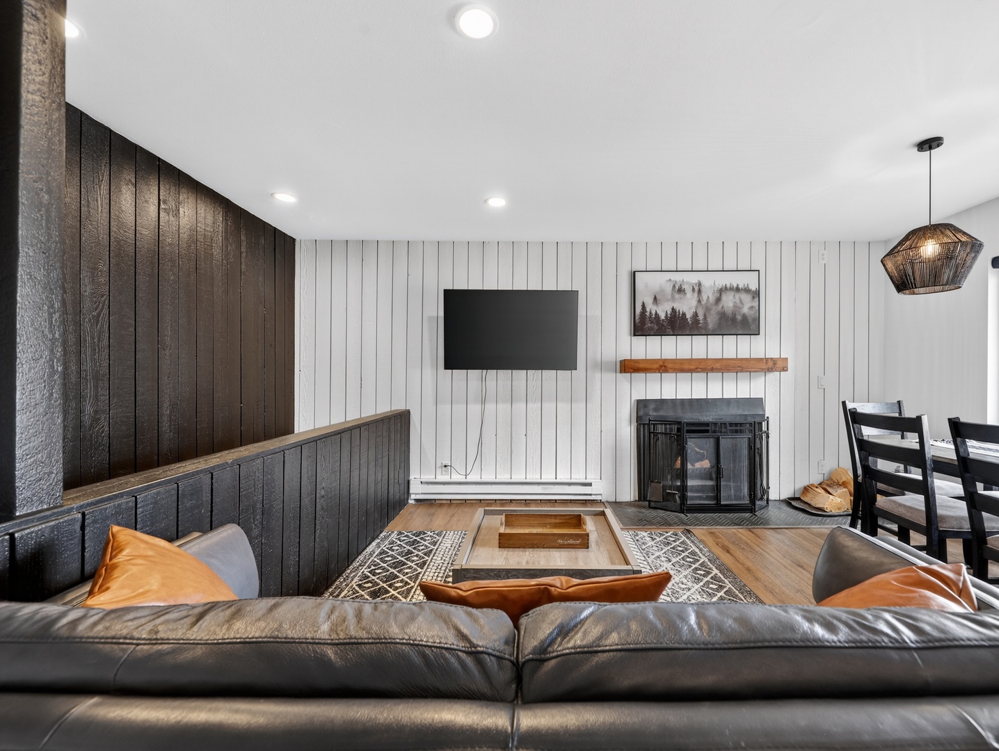 Gather, unwind, and recharge in this inviting living space with fireplace and mountain views