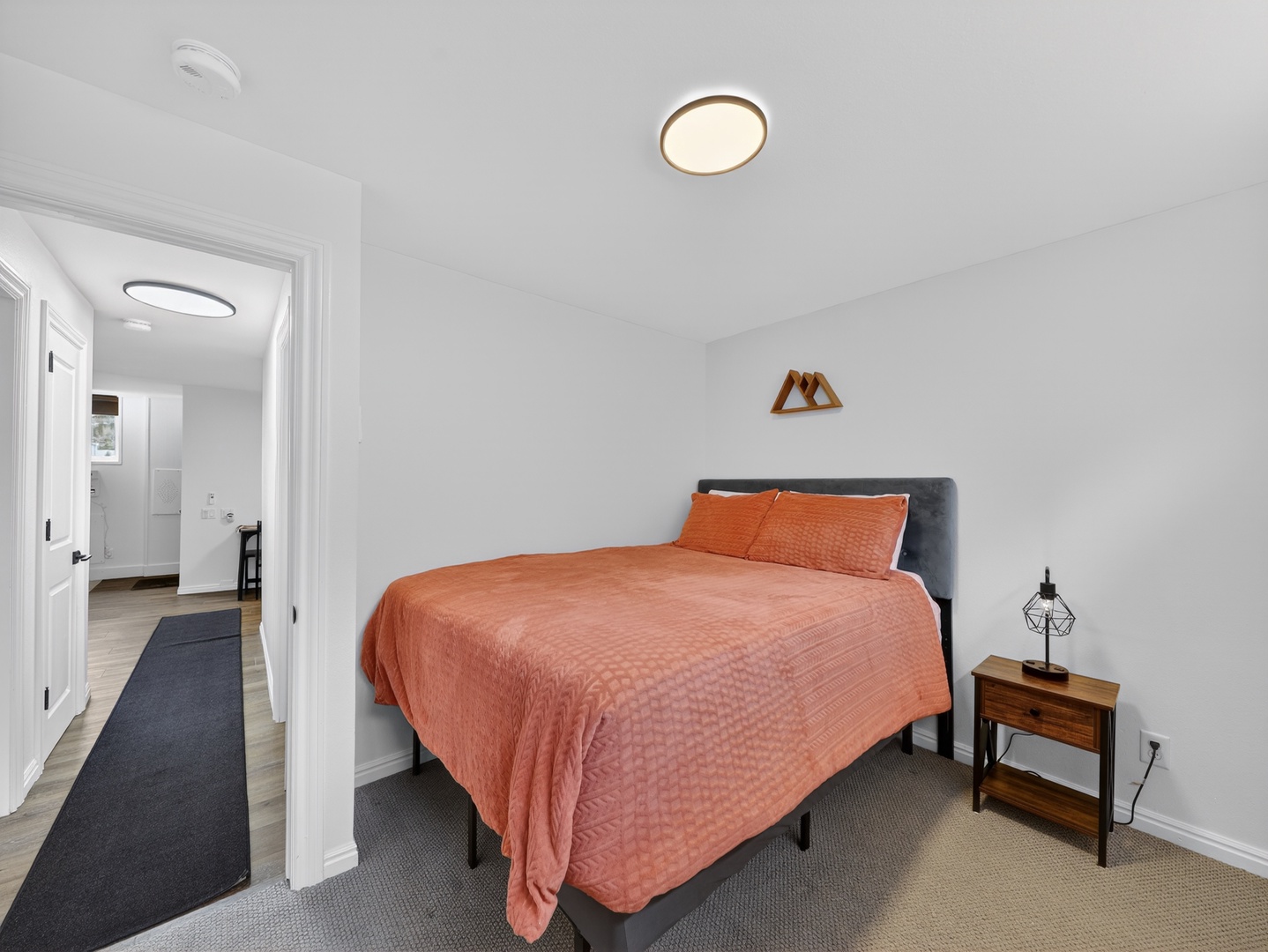Comfortable bedroom in the private lower-level suite—ideal for added space and privacy