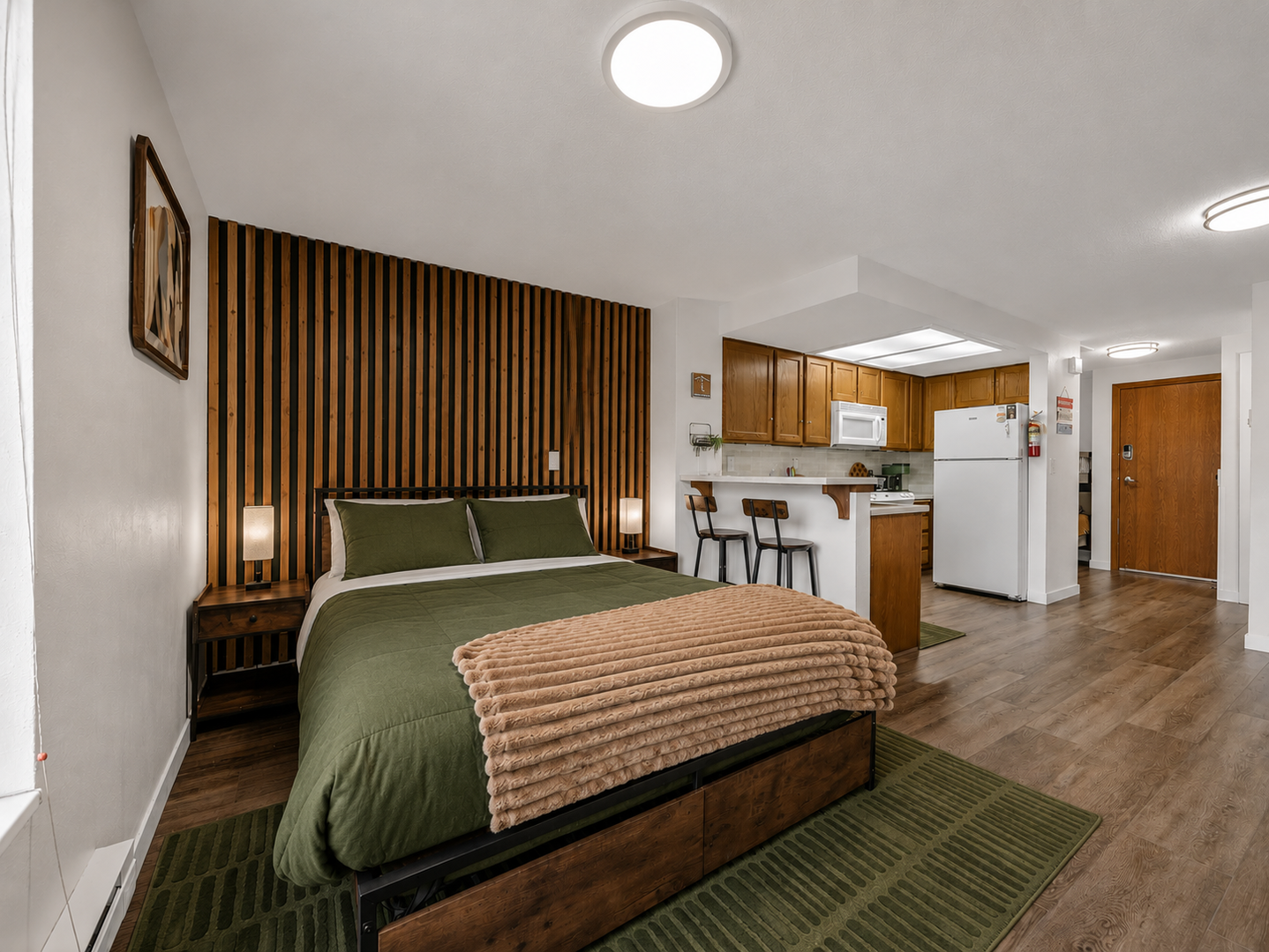 Sink into the plush bedding and wake to mountain views from your window. The open-concept space features a full kitchen and breakfast bar, perfect for cozy mornings in.