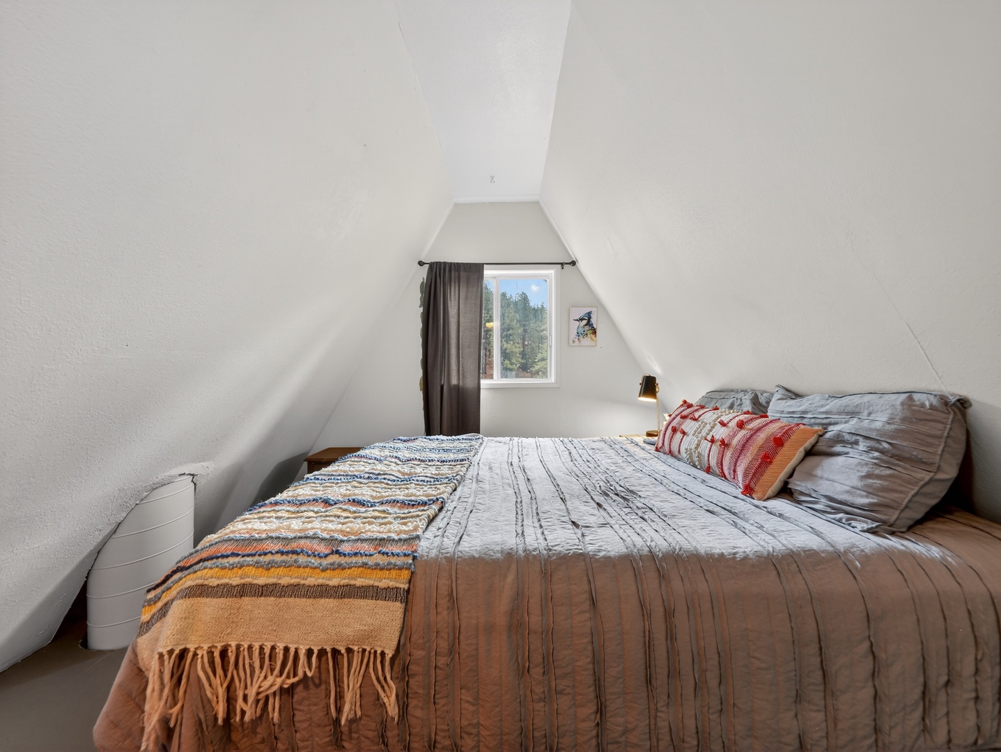 Inviting guest bedroom with warm cabin touches
