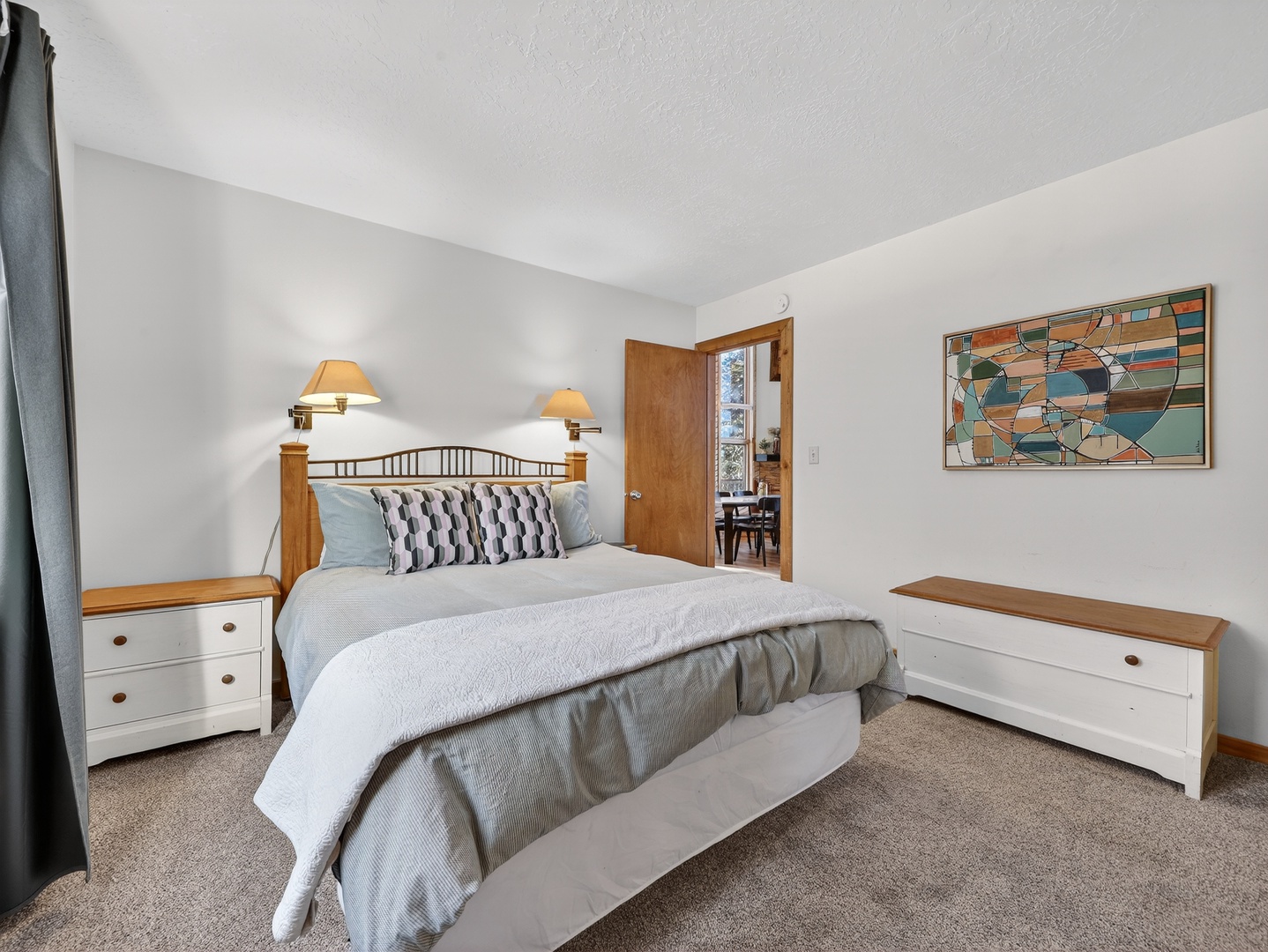 Sink into your cozy bedroom retreat with crisp linens, thoughtful lighting, and warm wood accents creating the perfect space for restful nights.