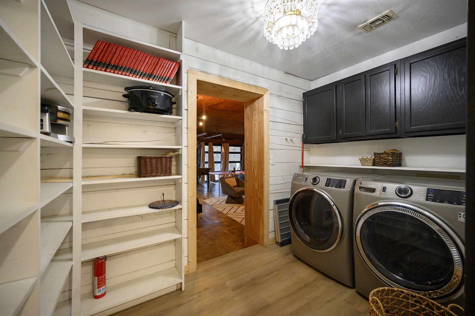 Your convenient laundry room features modern washer and dryer, plus generous storage shelving for all your vacation essentials.